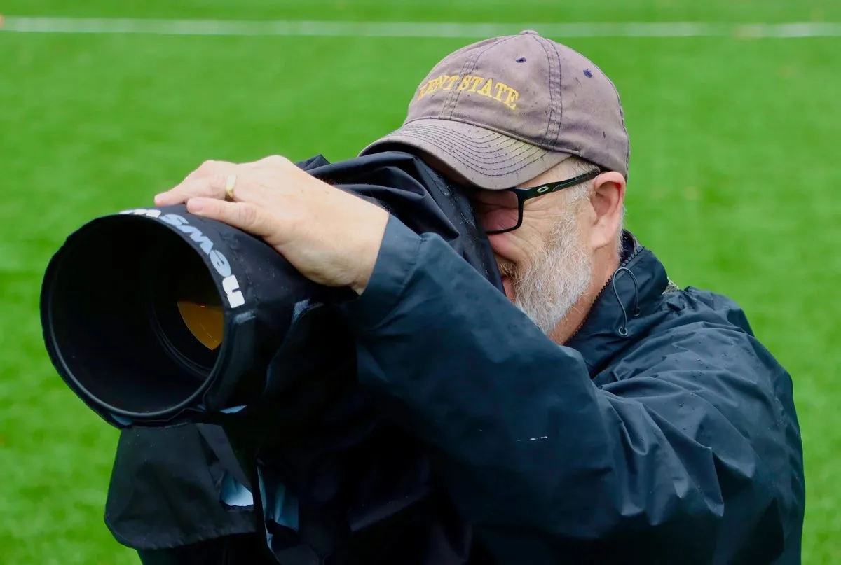 TMac photographing a youth soccer game with a professional telephoto lens