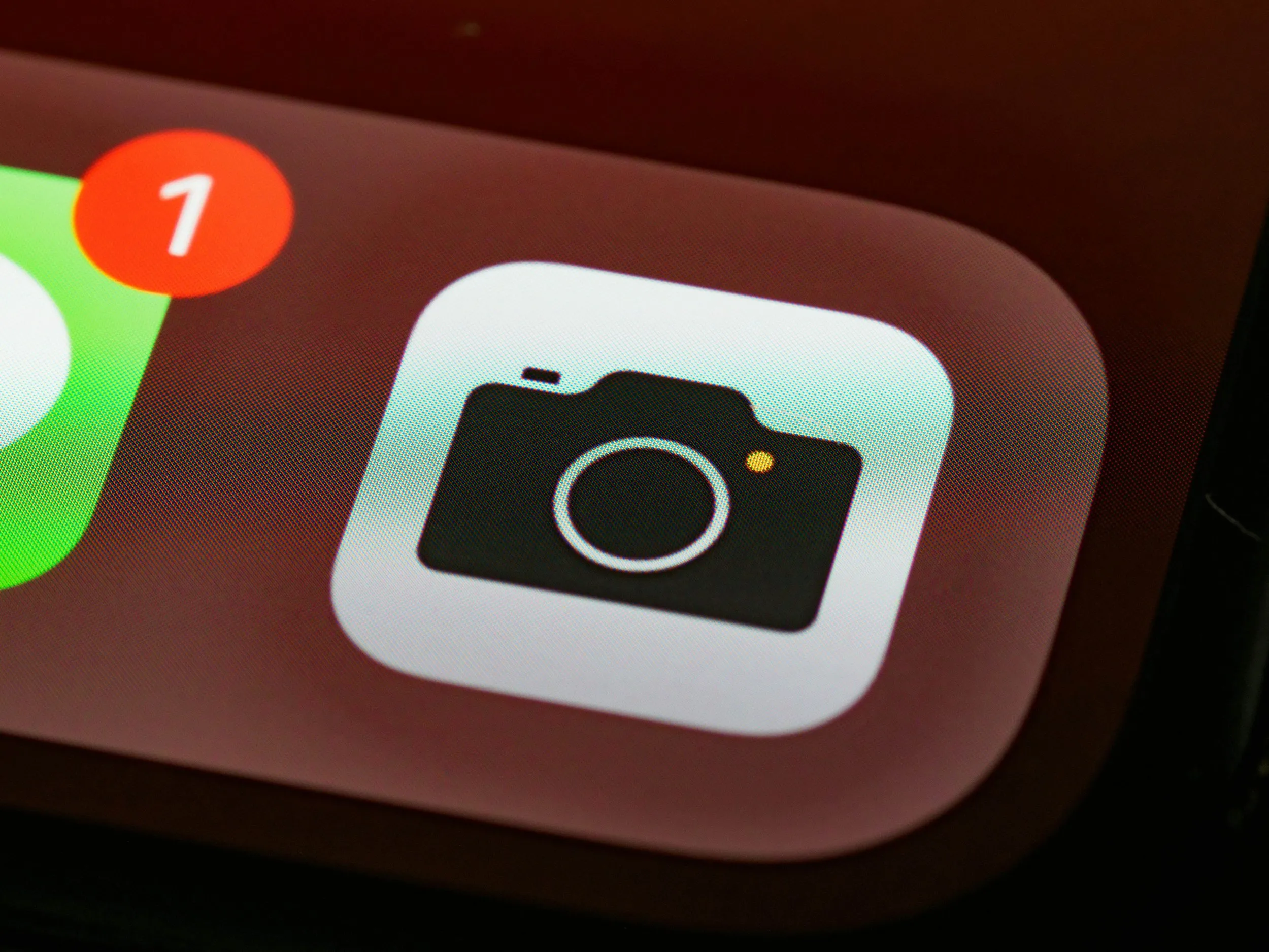 Close-up of the iPhone Camera app icon on a phone screen.