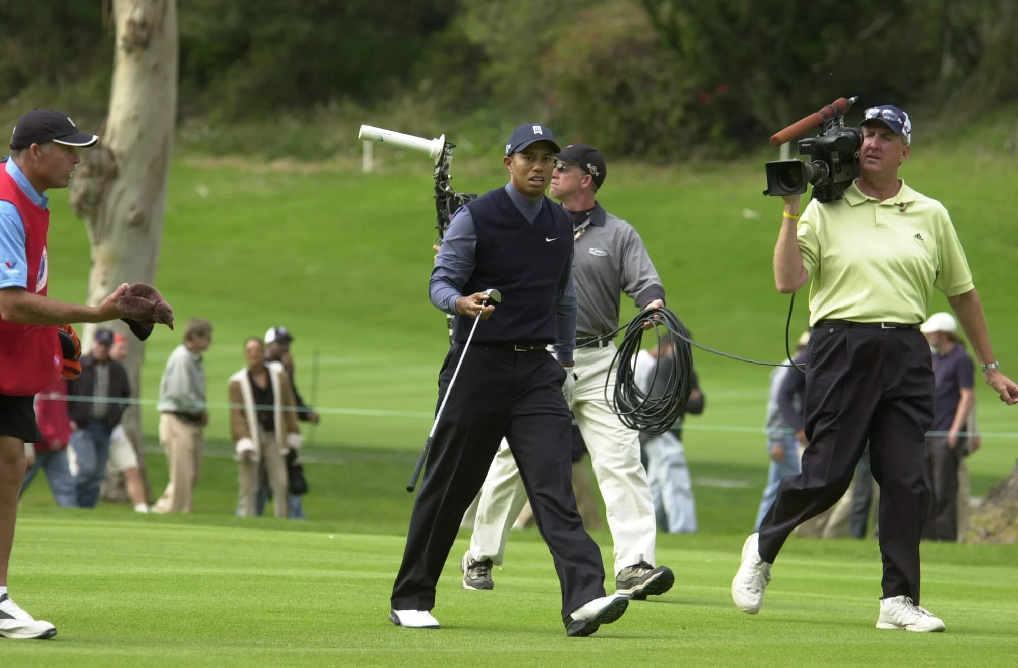 G Mark Bowden on the run to get the shot, golf broadcast camera work